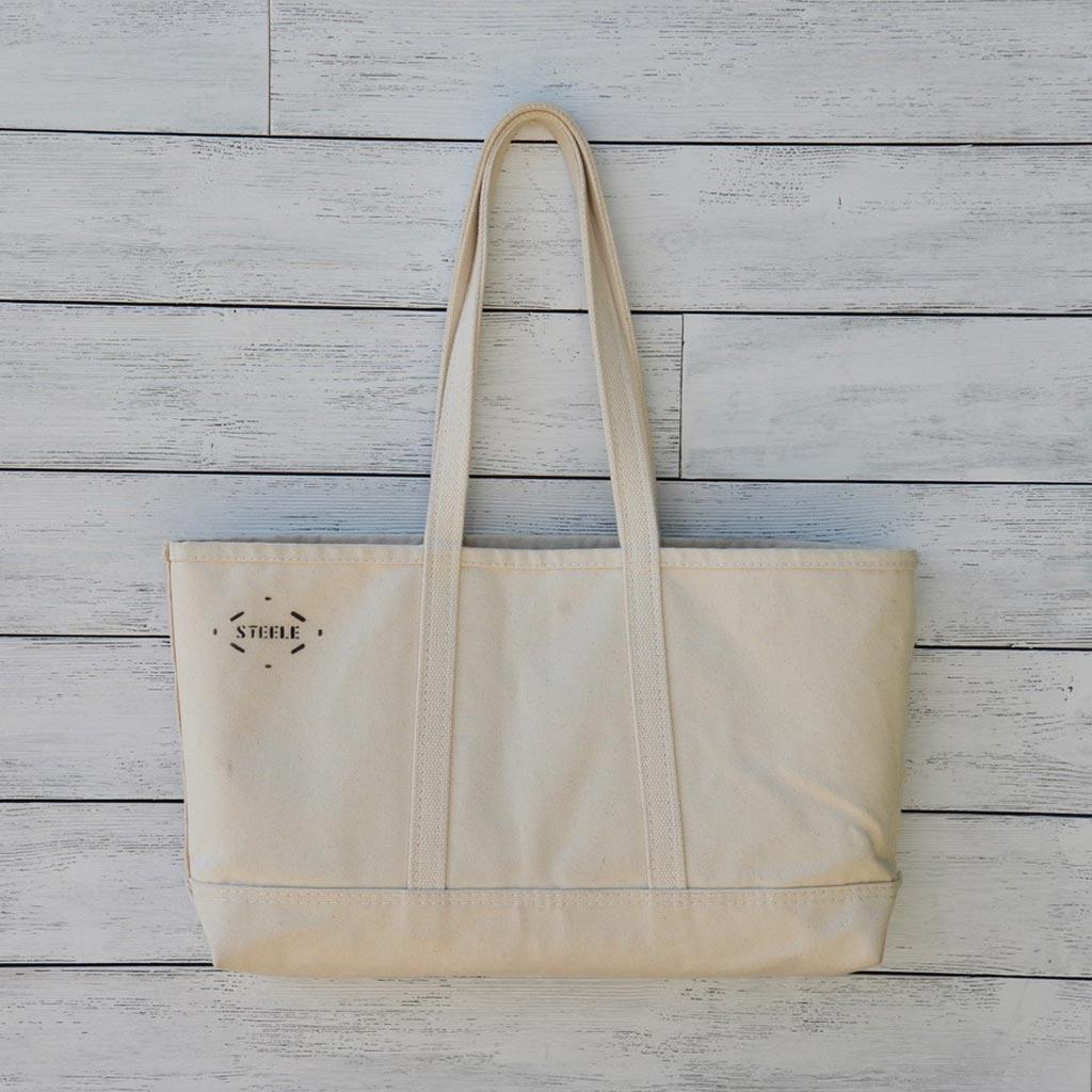 https://www.cohousa.com/cdn/shop/products/steele-canvas-tote-natural-by-coho-usa-3262.jpg?v=1507501959